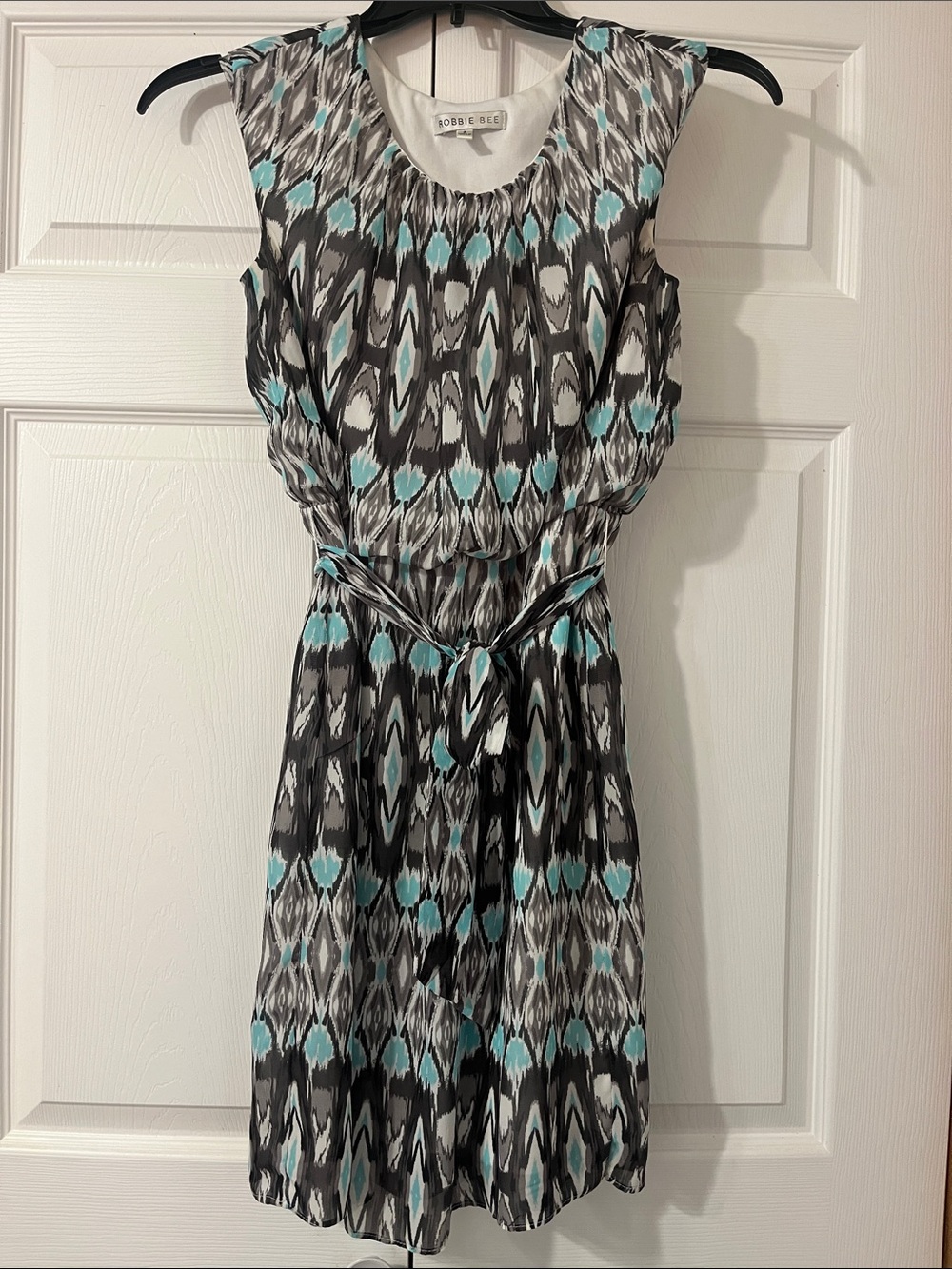 Robbie Bee Sleeveless Belted Dress in Teal, Black, and White